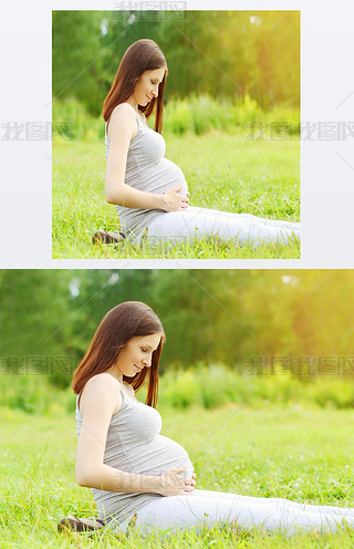 Portrait of happy pregnant woman sitting on the grass enjoys sun