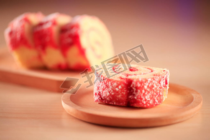 Red velvet cake on a wooden plate, close-up