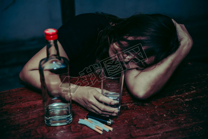 Asian woman drink vodka alone at home on night time