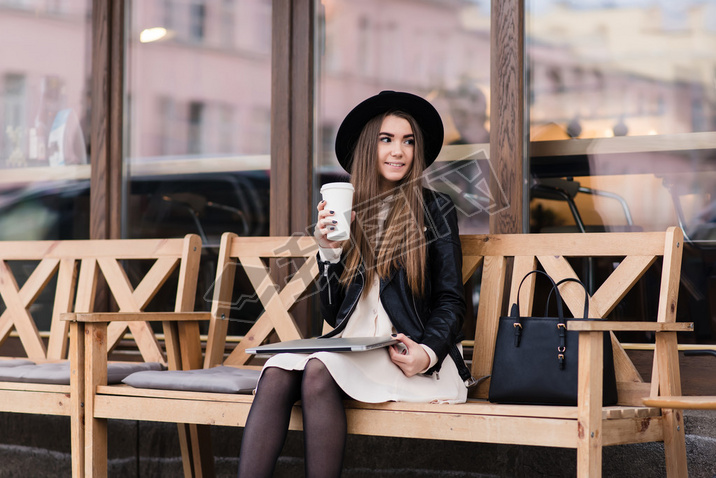 Trendy woman resting after work on net-book