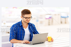 Positive freelancer working on the  laptop
