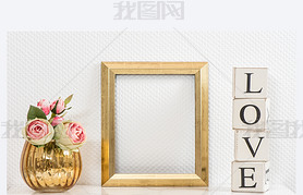 Mock up with golden frame and flowers. Love concept