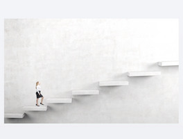 A young woman going upstairs steadily.