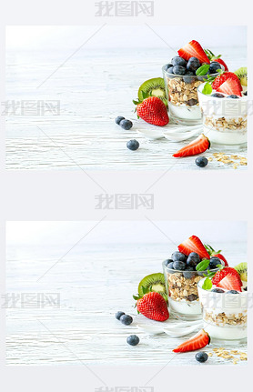 Healthy breakfast with muesli in glass, fresh berries and yogurt