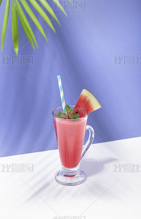 Fresh water melon juice and watermelon slice on color background