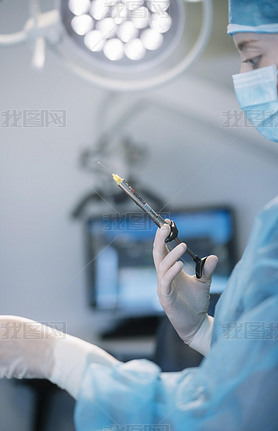 Dentist preparing a surgical syringe