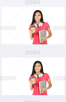Young woman with tablet pc, headphones and paper cup on white ba