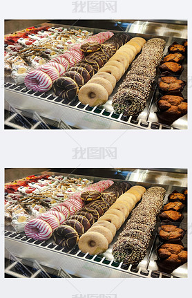 Assortment of sweet delicious cakes on the shop window.