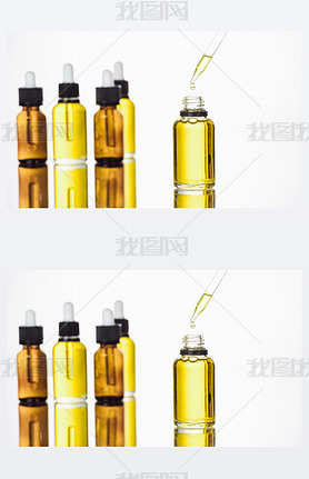 bottles and pipette with natural serum on surface with reflection isolated on white