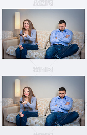 Portrait of couple sitting on sofa watching television.