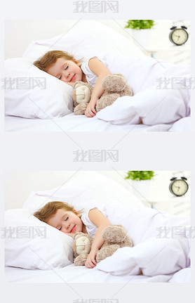 child little girl sleeps in the bed with teddy bear