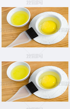Raw egg and olive oil in a all ceramic bowls for preparing homemade face and hair masks. Ingredien