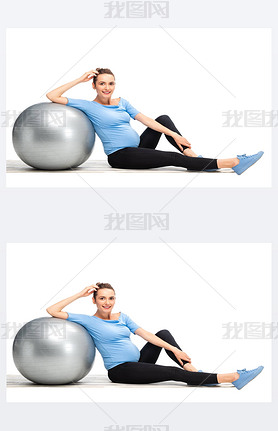 brown haired pregnant woman sitting on floor with grey fitness ball isolated on white