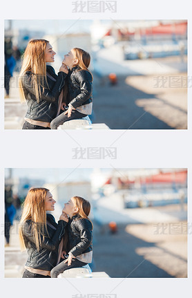 Mom and daughter spend time walking near the sea