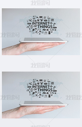 Hand holding tablet or modern art phone. Internet of things (IOT) background concept.