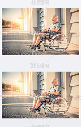 Man on wheel chair using computer