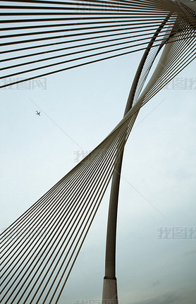 Plane and steel cable bridge