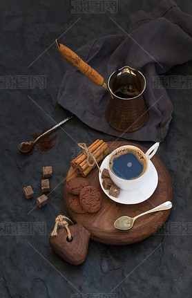 Cup of black coffee with chocolate biscuits