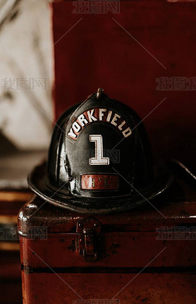 Vertical closeup shot of a firefighter helmet with Yorkfield and the number 1 written on it