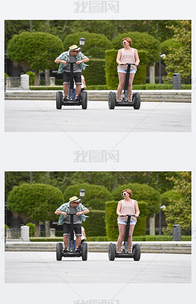 young happy tourist couple riding segway enjoying city tour in Madrid park in Spain together 