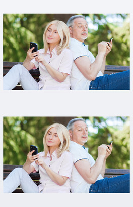 Mature couple using phones