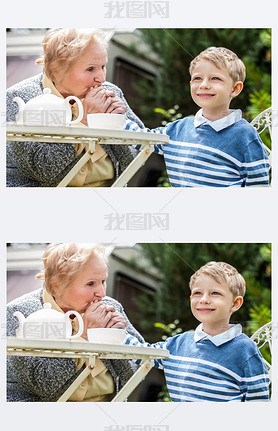 Positive grandmother and grandson spent time together in summer solar garden.