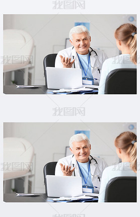 Mature male doctor working with patient in clinic