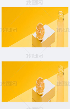 fresh juice in bottle near lemon and white cubes on yellow background, panoramic shot