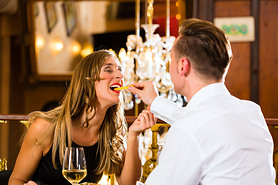 happy couple in restaurant eat fast food