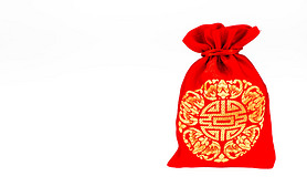 Red fabric bag or ang pow with Chinese style pattern on white ba