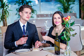 Gala dinner for two. Romantic dinner in the restaurant. Young loving couple visits a restaurant and 