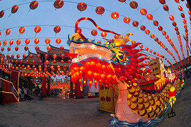 Red lanterns hanging in the blue sky and Dragon head lamp at twilight at the Lantern Festival in Chi
