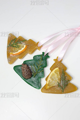 Florentine beeswax sachet shaped as Christmas tree on white background. Handmade aroma sachet. Wax s