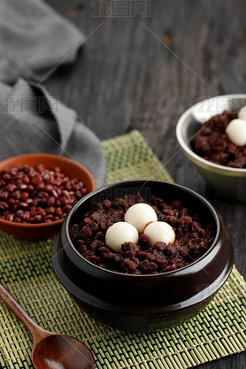 Korean Food Patjuk or Red Bean Porridge Topped with Round Rice Cake, Eat at Winter Solstice Festival