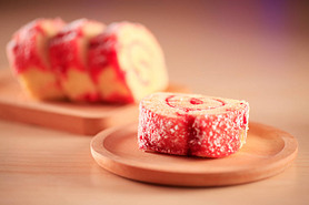 Red velvet cake on a wooden plate, close-up