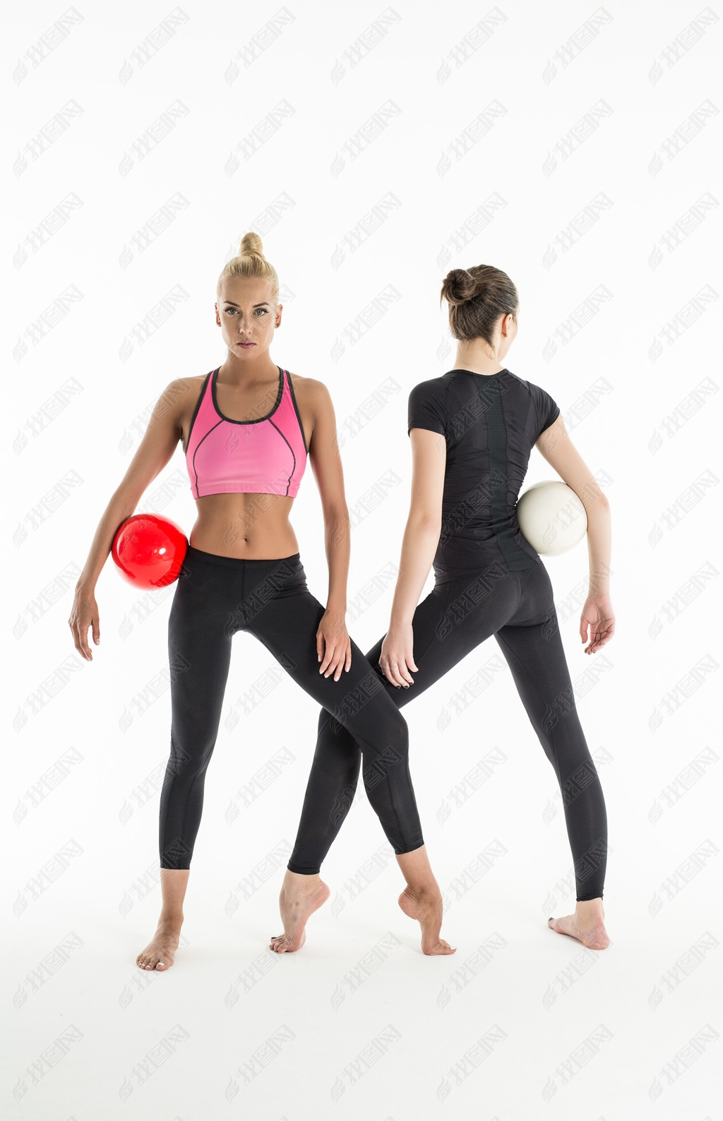 Two girls with balls