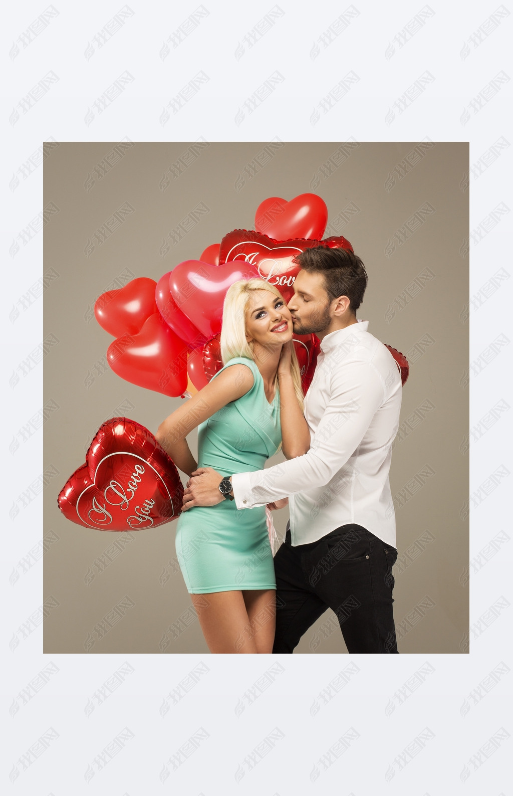 Kissing couple with red balloons