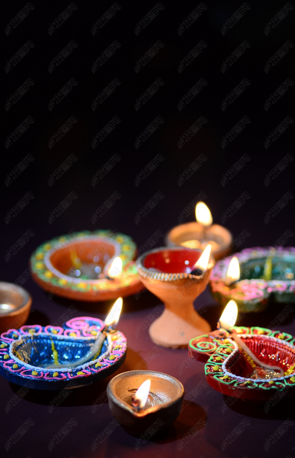 Colorful clay Diya (Lantern) lamps lit during Diwali celebration. Greetings Card Design Indian Hindu