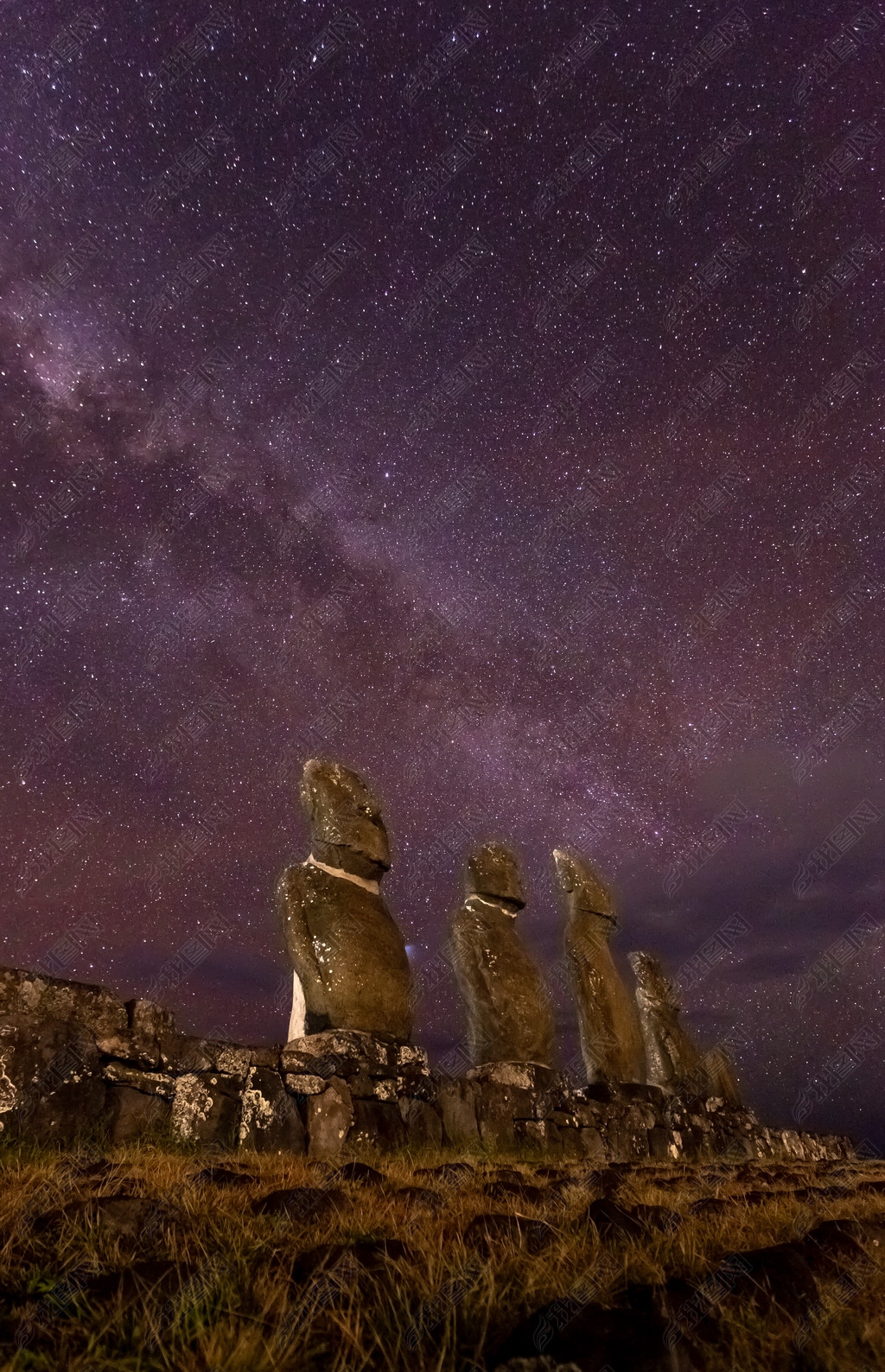 Moais in Ahu Vai Uri, Tahai Archaeological Complex, Rapa Nui National Park, Easter Island in the nig