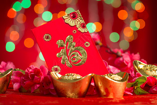 Chinese New Year decorations gold ingots and red packet