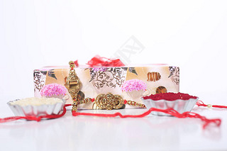 ӡȽڣRaksha BandhanŵRakhi  Rice GrainsKumkum ӡȴͳֵܽü䰮.