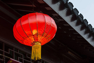 Asian lantern near national building decoration elements.