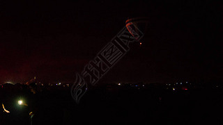 Hot air balloon flying over spectacular Cappadocia under the sky with milky way and shininng star at