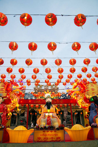 Original red lanterns in the blue sky and Godness lamp at evening at the Chinese New Year Celebratio