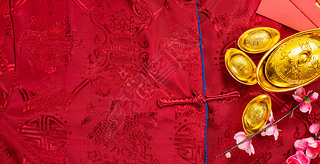 Chinese new year festival with home decoration and gold ingots on a blue color satin blanket .Chines