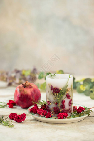 Handmade candles with dried flowers unique design. Scented candles decorated by dry leafs and blooms