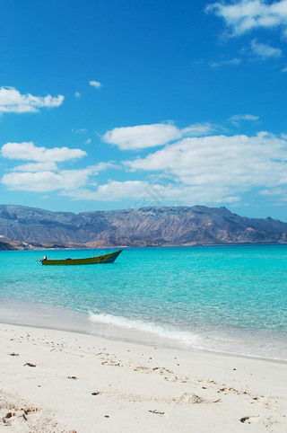 Socotra, Yemen, Middle East: the breathtaking landscape with a boat on the beach of Ras Shuab, Shuab