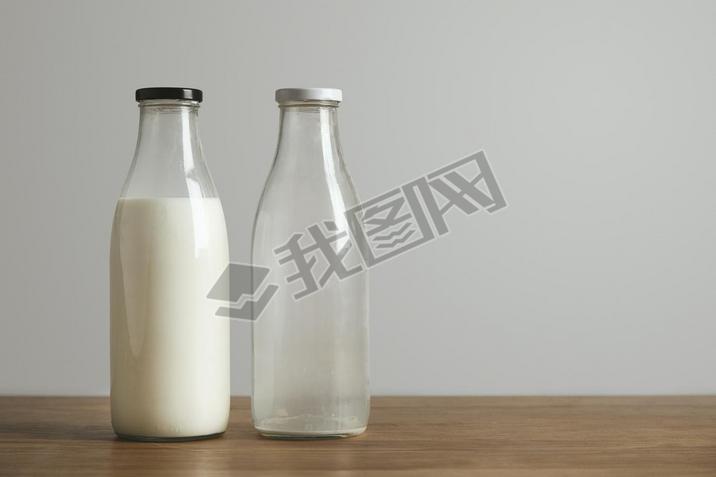 Simple vintage bottles with fresh milk and empty