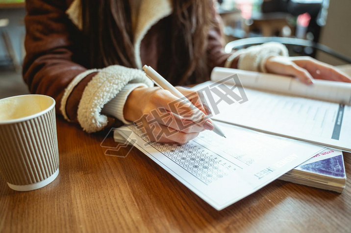 Pretty student doing grammar test in English