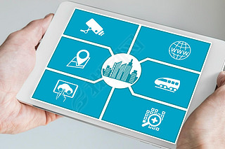 Smart city concept. Hand holding tablet or art phone with icons of connected devices.